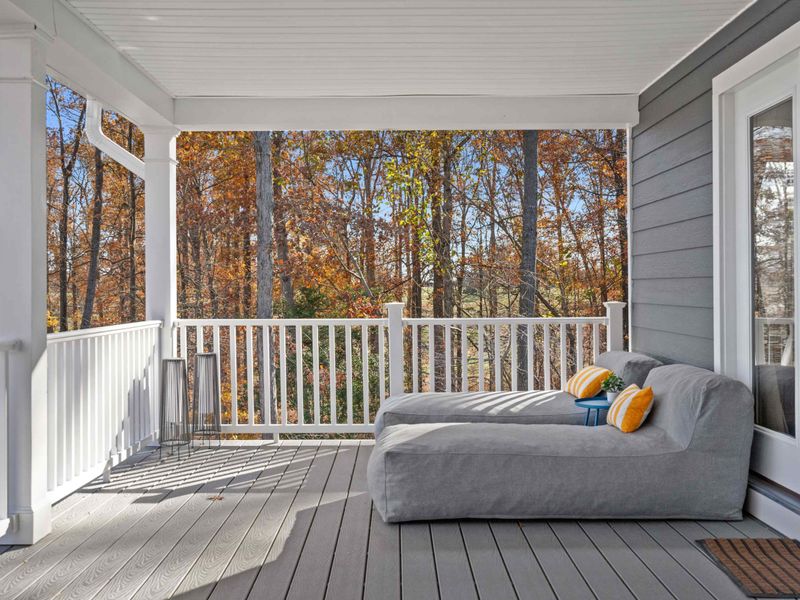 Side Porch - A daybed lounger tucked along the side of the wraparound deck, perfect for an afternoon nap with a breeze.