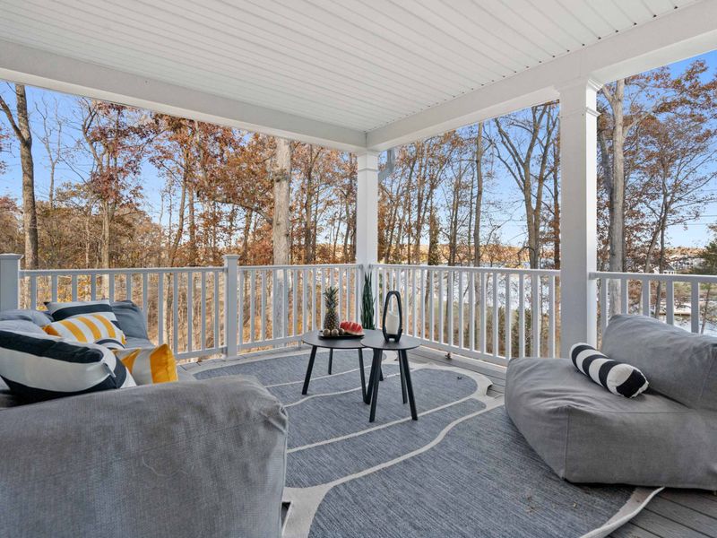 Lower Deck Lounge - Bean bag chairs and side tables create a relaxed hangout on the lower covered porch.