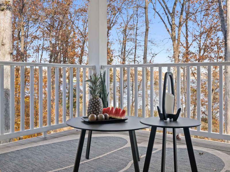 Deck Detail - Fresh fruit and a lantern on nesting tables add a welcoming touch to the outdoor living space.
