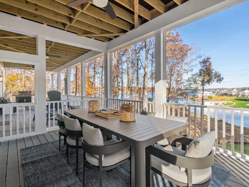Dinner with a View - The outdoor dining table from another angle, with the lake visible through the autumn trees.
