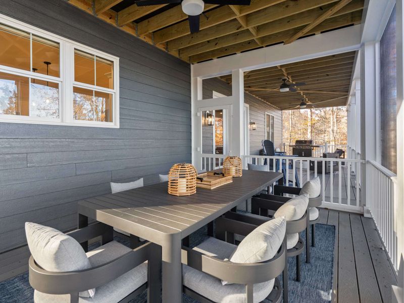 Al Fresco Dining - The covered outdoor dining area seats six comfortably, with the grill and fire pit lounge nearby.