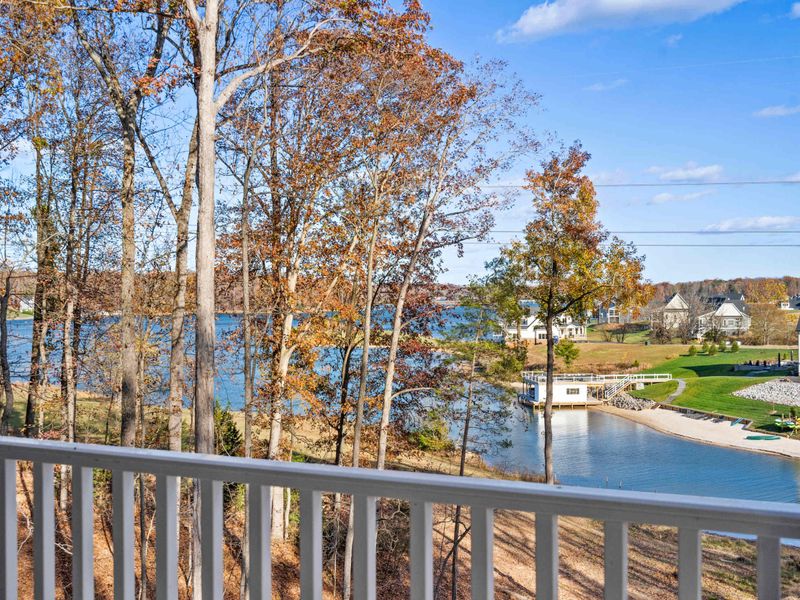 Lake View - The private-side waters of Lake Anna seen from the deck, with docks and homes dotting the shoreline through the trees.