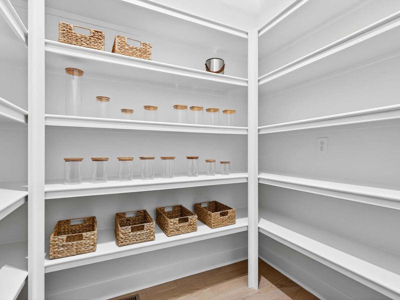 Walk-In Pantry - Glass jars, woven baskets, and generous shelving keep the kitchen organized and stocked for the whole group.