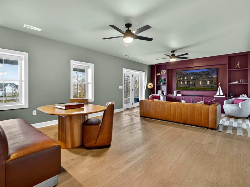 Lower Level Wide View - From the banquette to the entertainment wall, the lower level offers plenty of room to spread out and play.