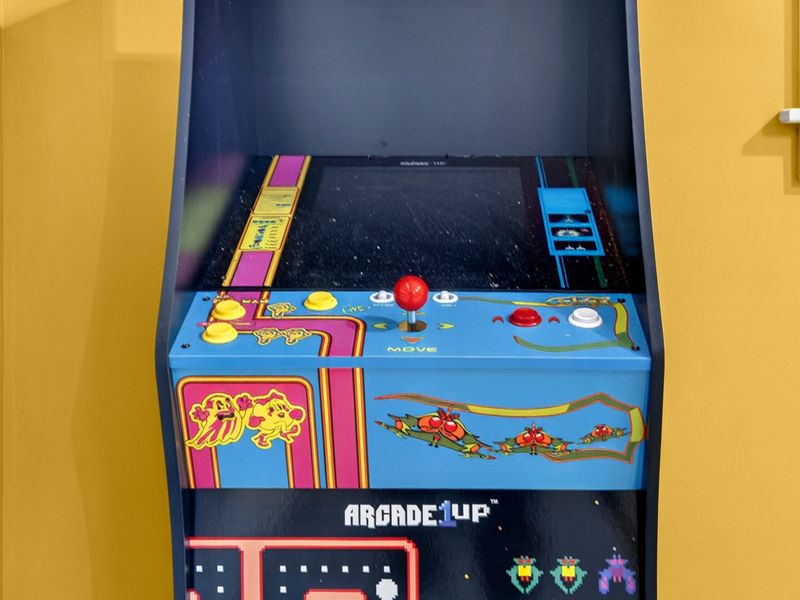 Ms. Pac-Man Arcade - A classic Ms. Pac-Man and Galaga arcade cabinet in the garage game room.