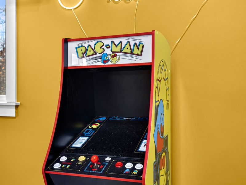 Pac-Man Arcade - The original Pac-Man arcade cabinet, adding retro fun to the game room lineup.