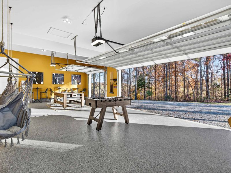 Indoor-Outdoor Game Room - With the garage doors up, the game room opens to the trees and fresh air for a true open-air hangout.