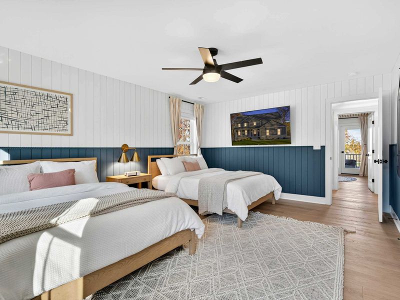 Double Queen Bedroom - Two queen beds, shiplap accents, and a mounted TV make this a comfortable shared room for families or friends.