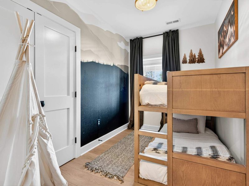 Kids Room - A mountain mural, twin bunk bed, and a playful teepee make this room a favorite for younger guests.