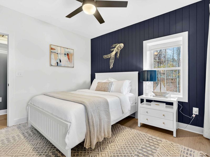Queen Bedroom - A second angle showing closet storage and window views, with plenty of room to settle in.