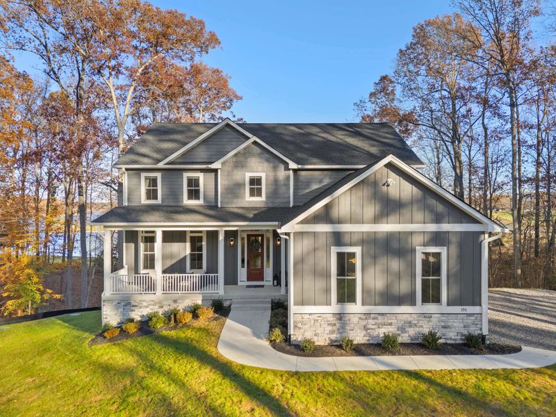 Front Exterior - The full facade in autumn color, with a welcoming front porch and clean landscaping.