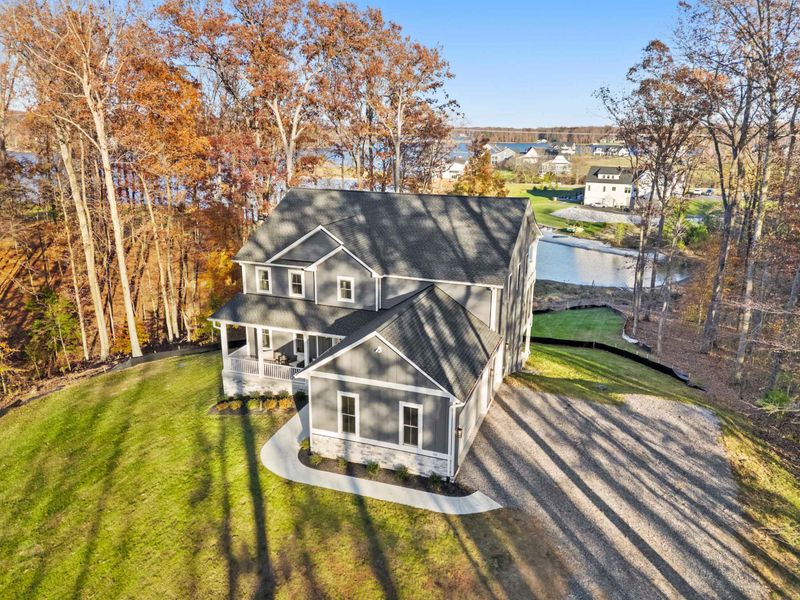 Aerial View - From above, the property reveals its proximity to the water and the surrounding Rock Island Landing community.
