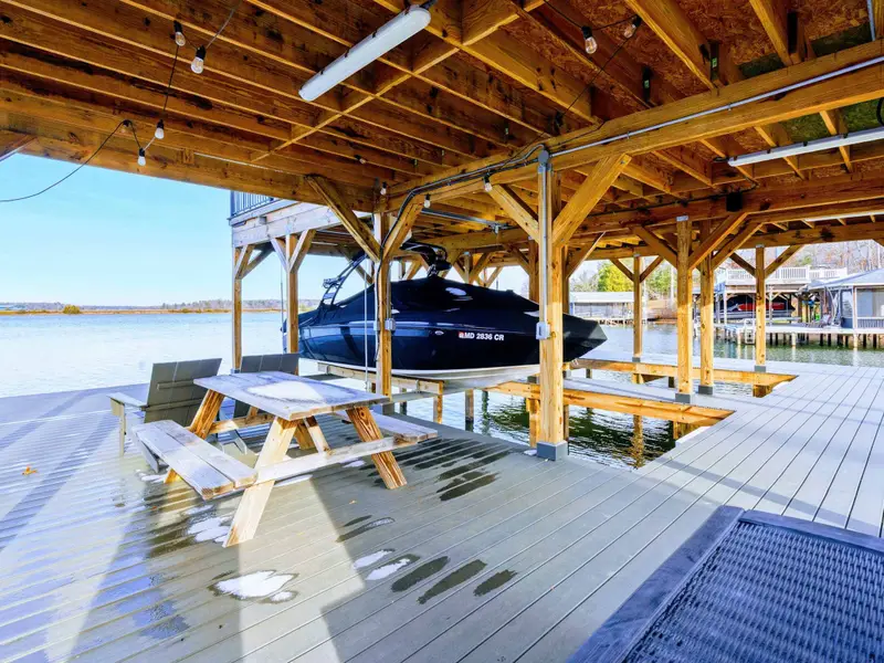 Giant Connect Four - Oversized yard games on the patio keep guests entertained between lake sessions.