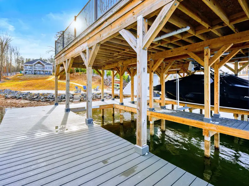 Lower Patio - Another angle of the covered outdoor dining area, with the patio extending toward the lakefront.