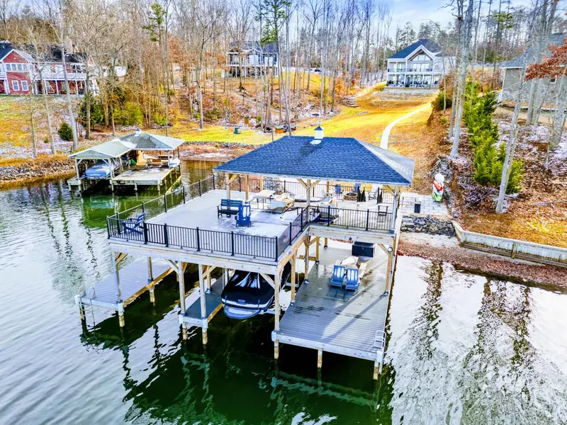 Deck View - The covered deck stretches wide with lake views from every angle and plenty of room to spread out.