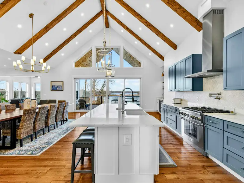 Lower Kitchen Galley - Stainless appliances, quartz counters, and a gold pendant light keep this second kitchen stylish and functional.