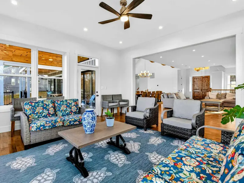 Game Room - A ping pong table, oversized sectional, big-screen TV, and stone fireplace make the lower level a hub for entertainment.