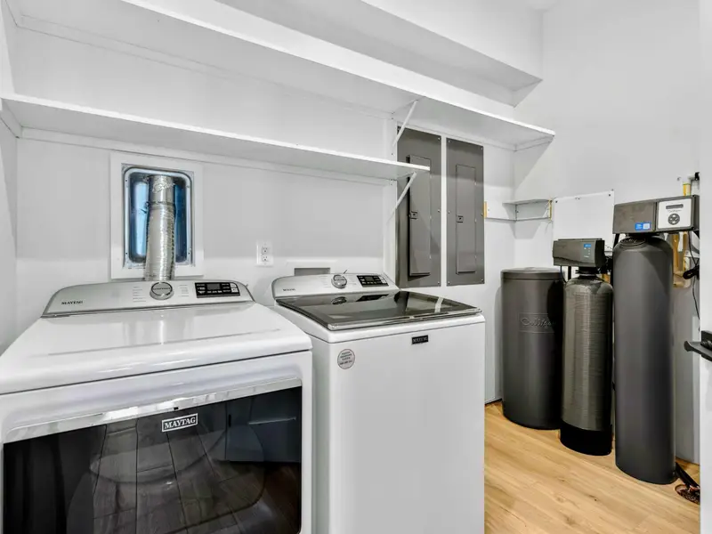 Laundry - A dedicated laundry room with full-size Maytag washer and dryer, plus a water softener system.
