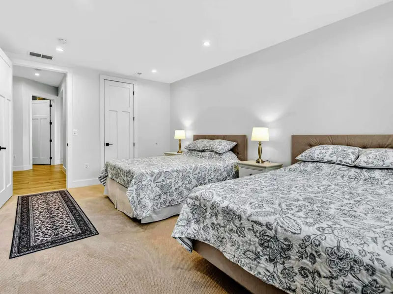Lower Bedroom 6 - From the hallway, the two queen beds and closet show how spacious this lower-level room is.