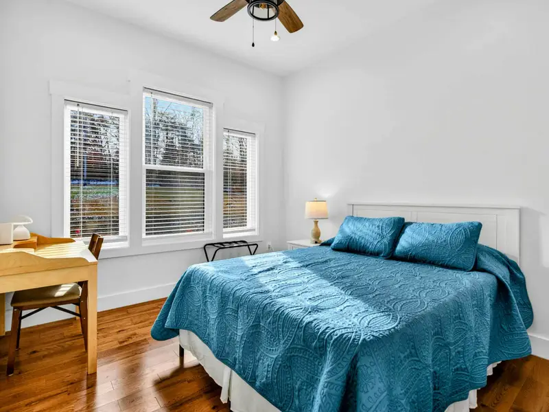 Bunk Room - The two twin-over-full bunks sit side by side between the windows, maximizing sleeping space for families.