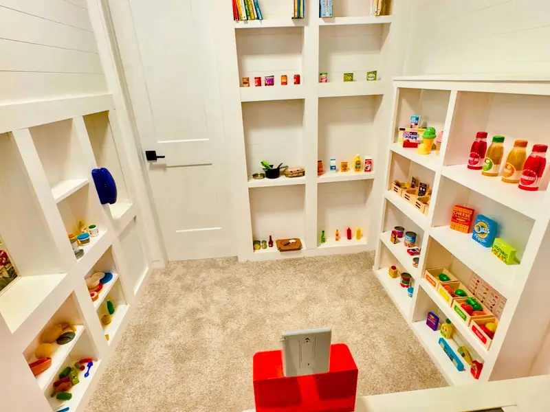 Market Overview - The full interior of the Blueberry Bay Market with a Target scanner and cash register that lights up to scan all the market items. The shelves are stocked with quality play food. The kids will play for hours.