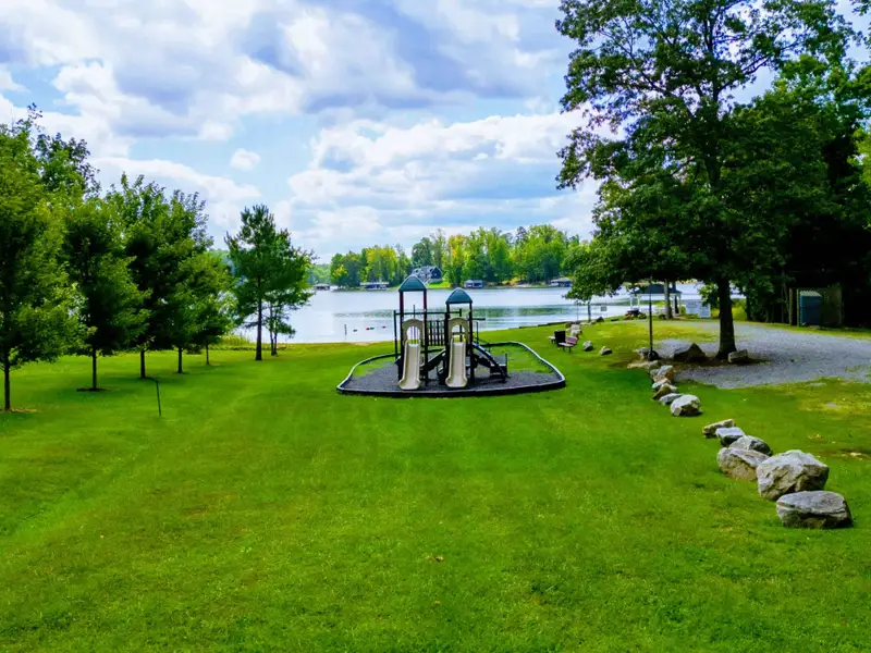 Community Playground - A lakeside playground where younger guests can climb, swing, and play between swims.