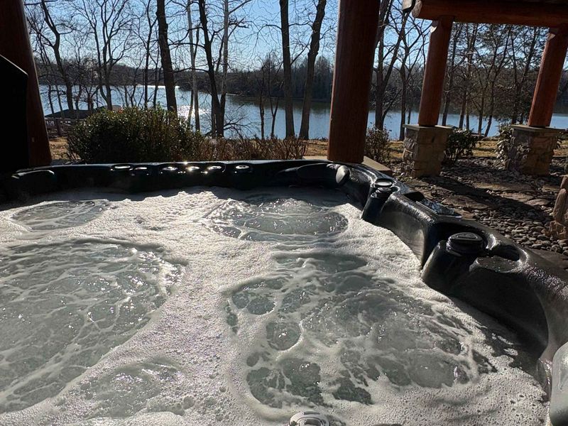 Enjoy soaking in the hot tub with the beautiful lake views!