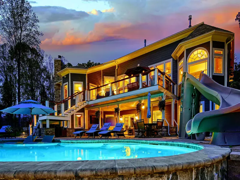 Custom water slide leading straight into the pool — a kid favorite and a grown- up guilty pleasure.