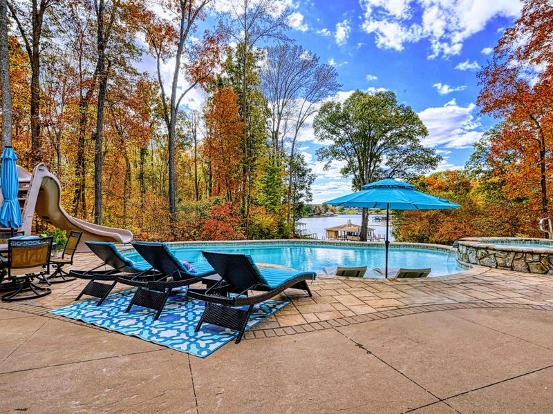 Expansive upper deck + lower patio with multiple seating zones for sunning, reading, and long late-night conversations.