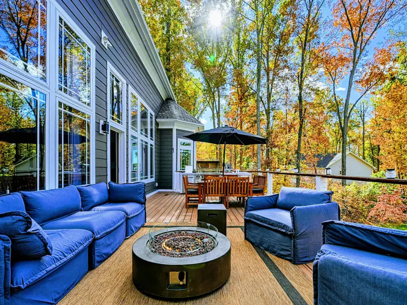 Expansive upper deck + lower patio with multiple seating zones for sunning, reading, and long late-night conversations.