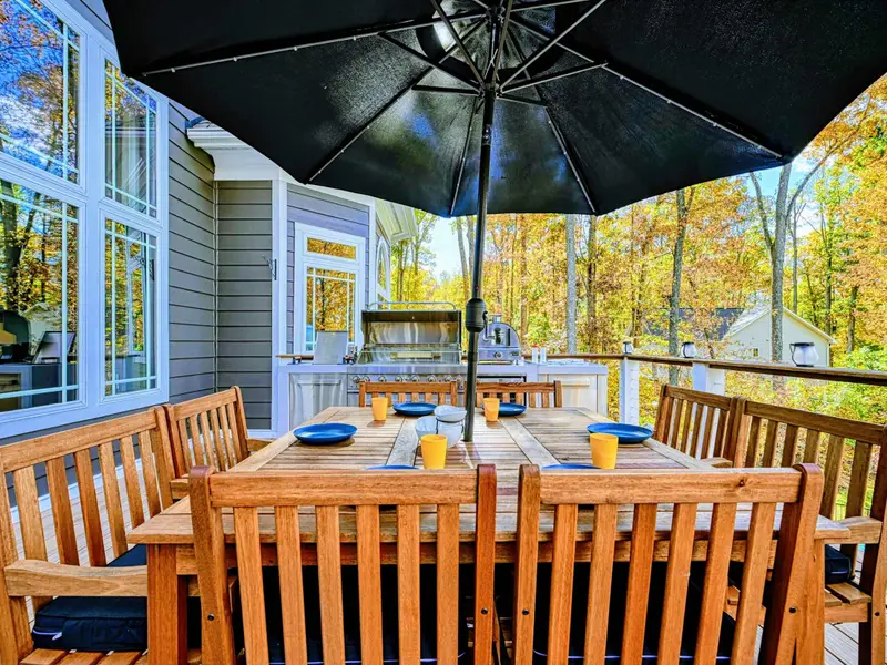 Dine with a view at a beautiful farm-style teak table for eight, complete with an oversized umbrella for sunny afternoons and a refreshing lake breeze to elevate every meal.