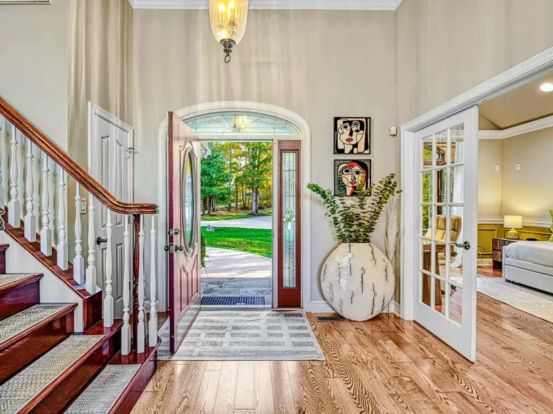 Step through the front door and into a soaring great room that marries classic architecture with curated modern design.