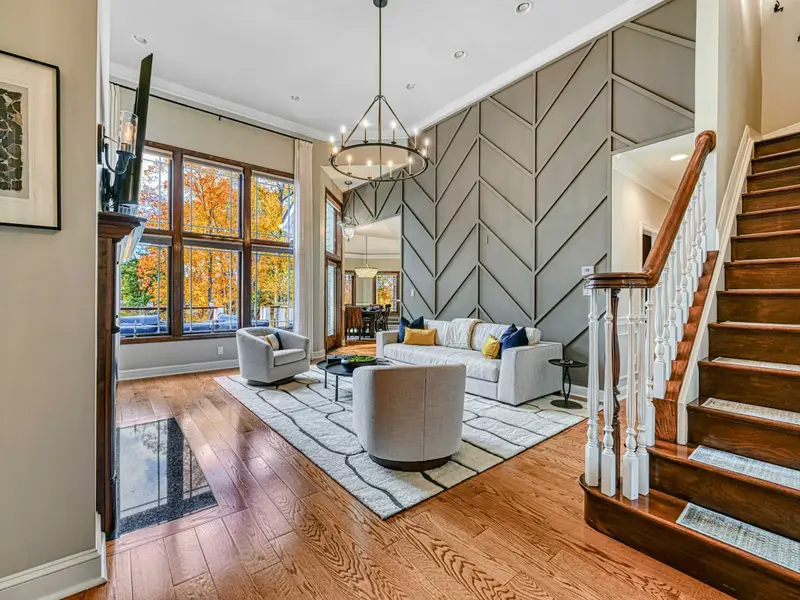 Step through the front door and into a soaring great room that marries classic architecture with curated modern design.