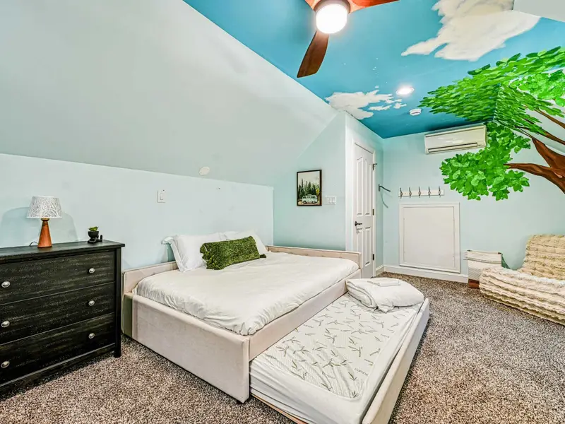 This whimsical kids’ loft features two double beds with pull-out trundles (sleeps up to 8), hand-painted treehouse murals, a twinkle-lit teepee, and cozy reading nooks—screen-free, magical, and made for unforgettable sleepovers.