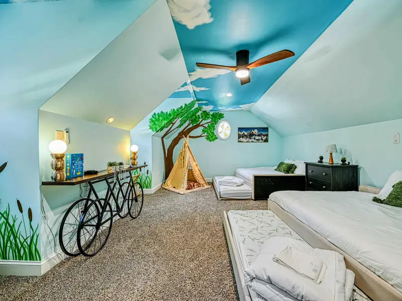 This whimsical kids’ loft features two double beds with pull-out trundles (sleeps up to 8), hand-painted treehouse murals, a twinkle-lit teepee, and cozy reading nooks—screen-free, magical, and made for unforgettable sleepovers.