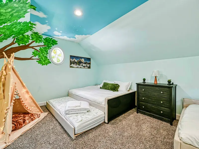 This whimsical kids’ loft features two double beds with pull-out trundles (sleeps up to 8), hand-painted treehouse murals, a twinkle-lit teepee, and cozy reading nooks—screen-free, magical, and made for unforgettable sleepovers.