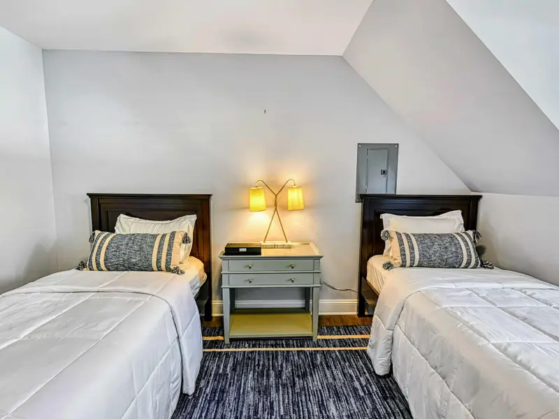 Guest Apartment: Above the 3-car carriage house, this fully finished space offers extra bedrooms for teens, grandparents, or friends who want privacy and comfort—perfect for flexible group stays.