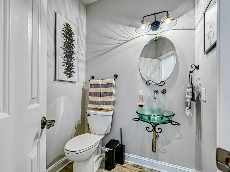 Stylish half bath —perfect for guests and quick touch-ups without missing a moment of vacation fun.