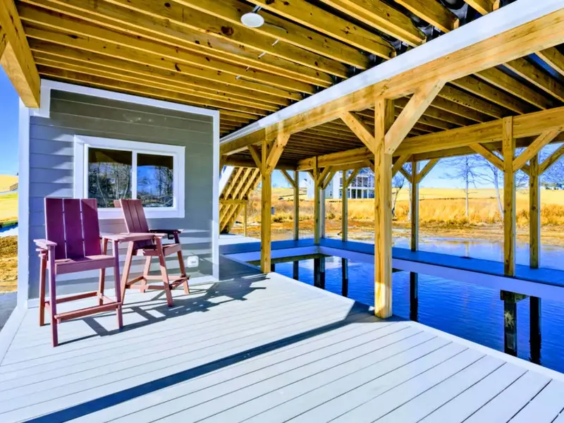 Shade, Seats, and Still Water – A quiet dockside nook for slow conversations and cool breaks between swims.