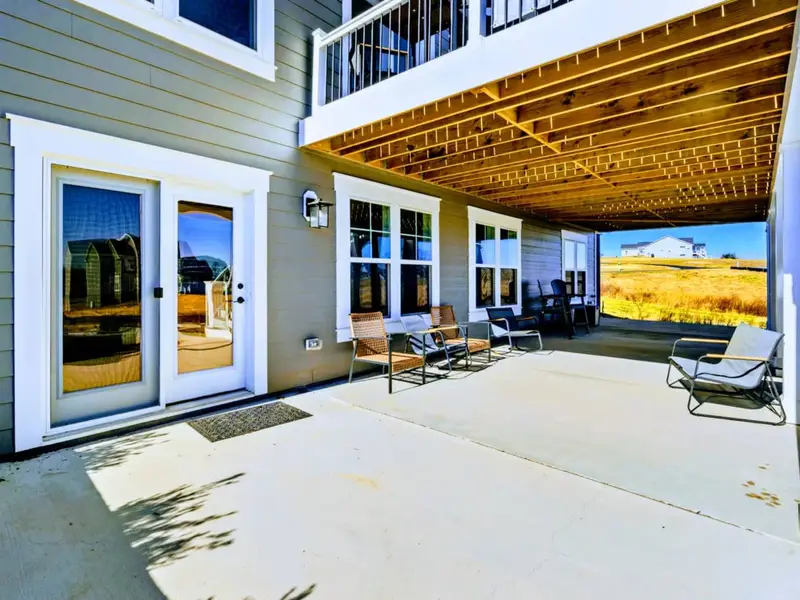 The Covered Hangout – An easy walkout spot for morning chats, post-lake lounging, and family time that feels effortless.