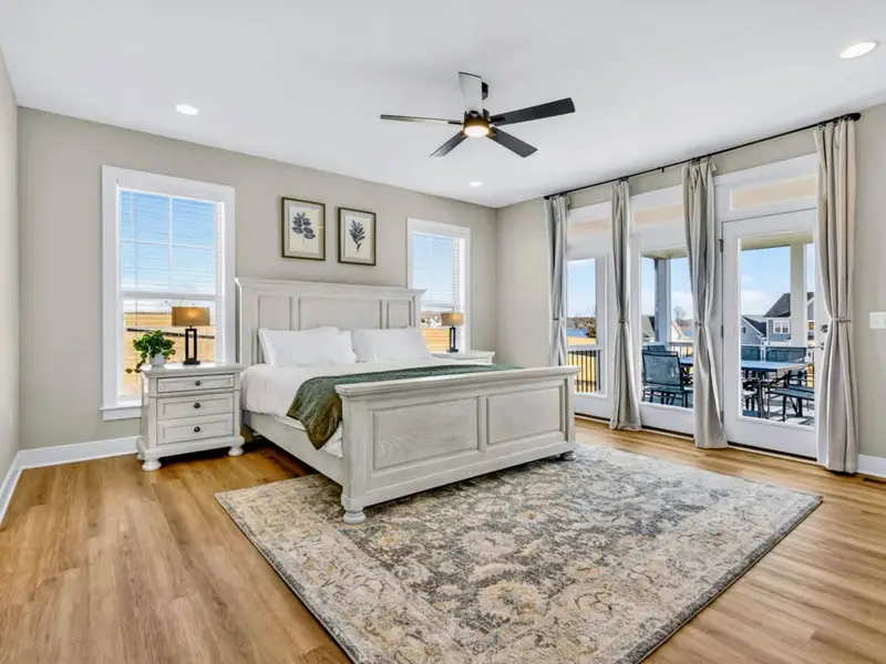 Primary Suite Elegance – Refined comfort with a private outdoor escape just beyond the doors.