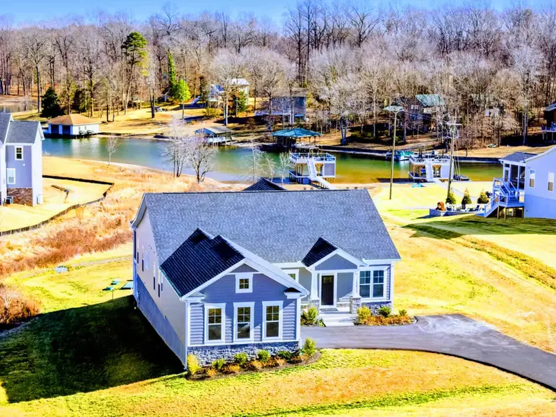 Lakeside Living, Elevated – A refined retreat with water nearby and space all around to truly unwind.