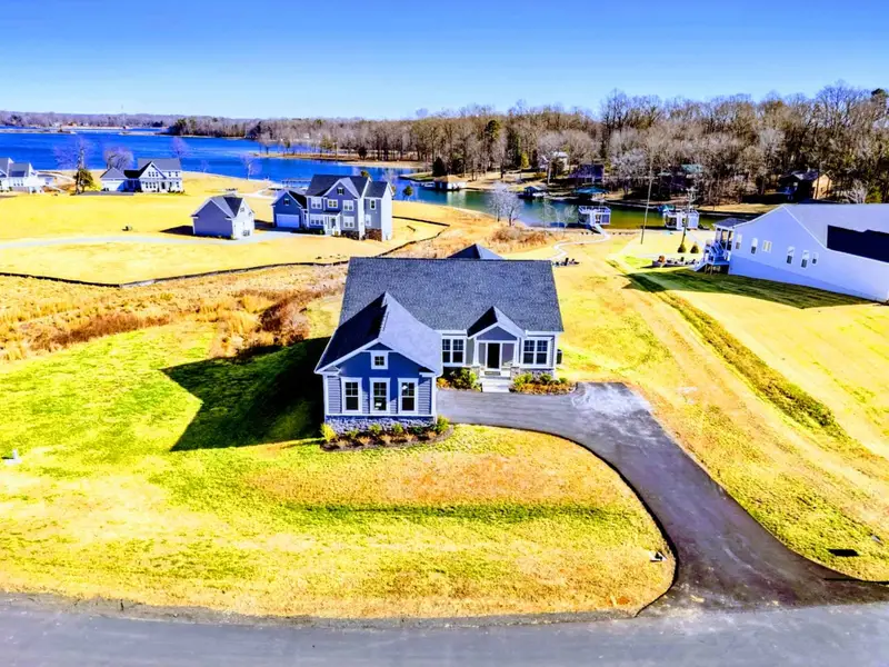 Lakehouse Living, Beautifully Set – A refined retreat in a peaceful setting designed for easy time together.