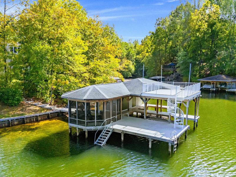 Boathouse - Two stories out over the water, a screened porch and covered dock below and an open sun deck up top for taking in the view.