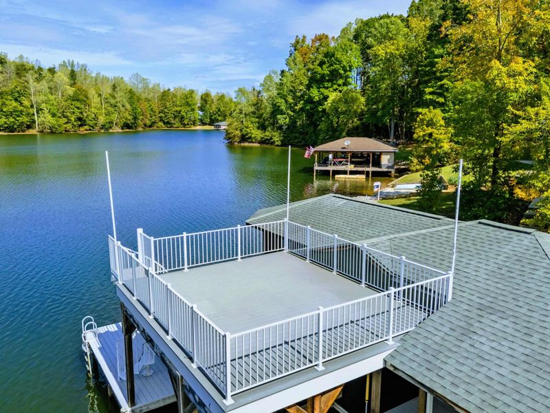 Dock Sun Deck - Spacious upper deck with white railings offers panoramic views across the lake.