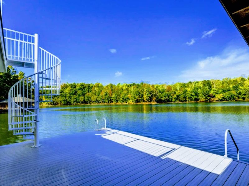 Dock - A spiral stair and low swim platform reach into the calm, warm water, the easiest way to slip straight into the lake.