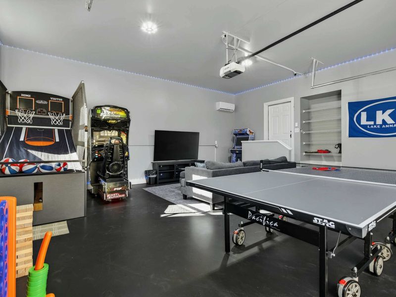 Game Room - The converted garage packs in ping pong, arcade basketball, a racing simulator, and lounge seating, the rainy-day favorite for all ages.