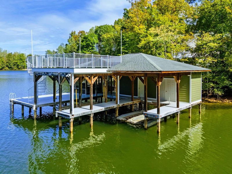Boathouse - Two-story boathouse with a covered lower level, screened porch, and rooftop sun deck.