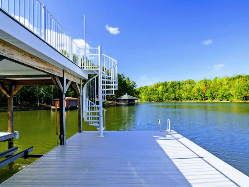 Private Dock - Spiral staircase and dock platform extend into the lake with beautiful open water views.
