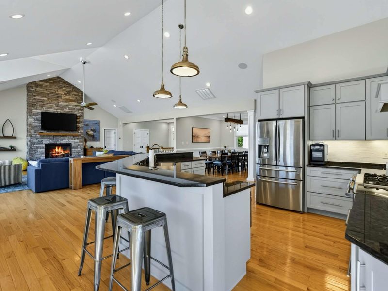 Kitchen - The generous island with bar seating anchors the open-concept kitchen and living area.